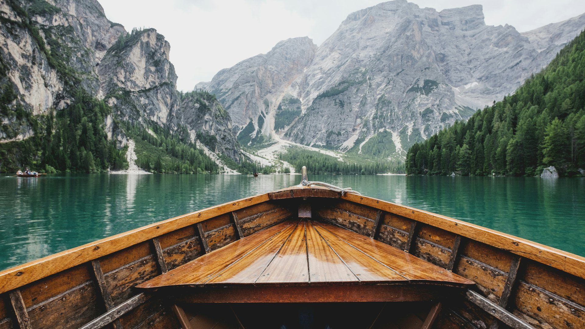 Wooden rowing boat on Lago di Braies in the Dolomites