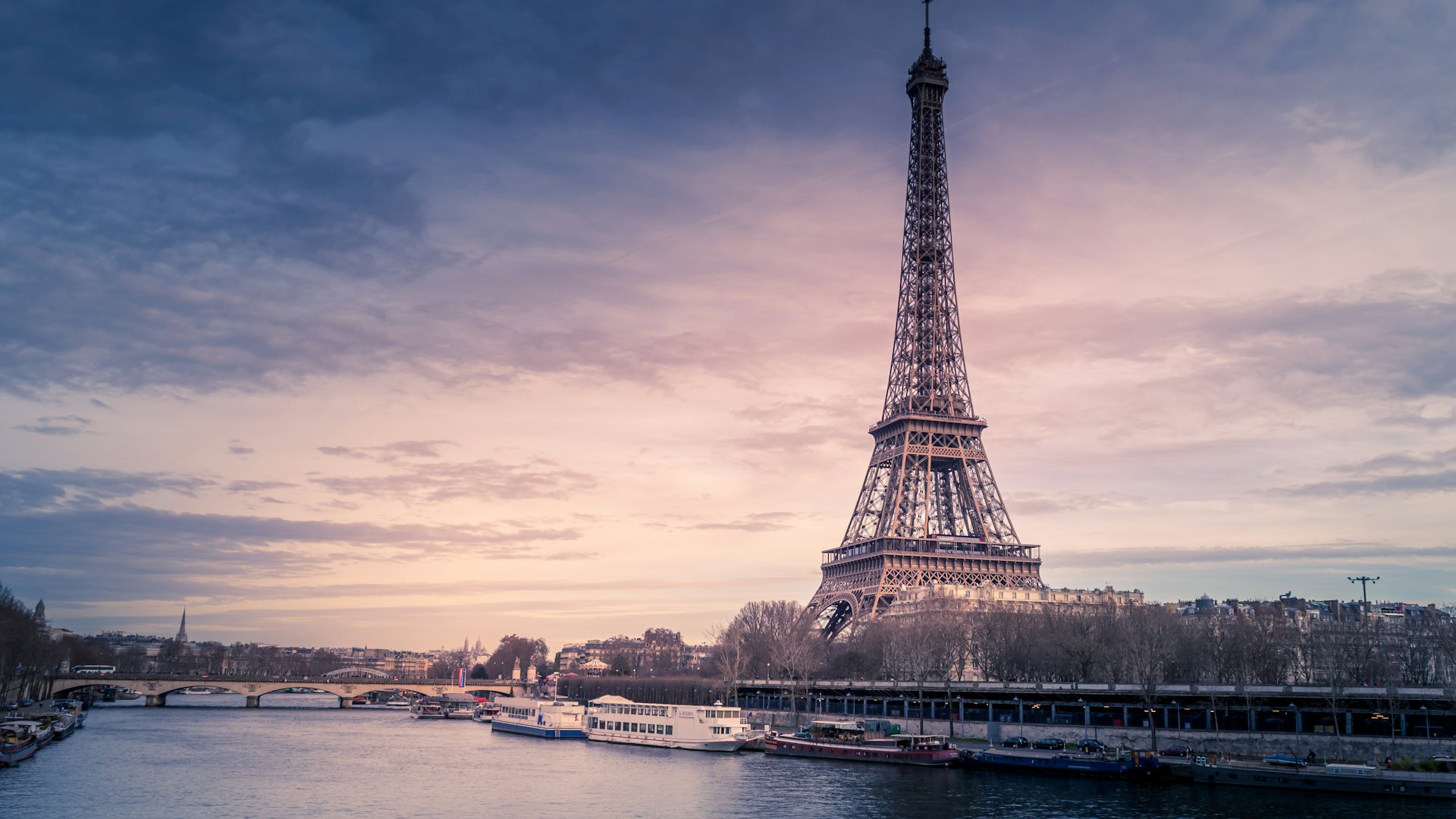 Eiffel Tower over the Paris skyline at dusk